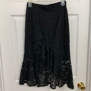 DO BE Size Small lace sexy black skirt.  Mini skirt lining with lace ruffle